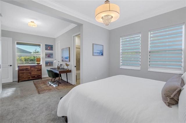 carpeted bedroom featuring ensuite bathroom and crown molding