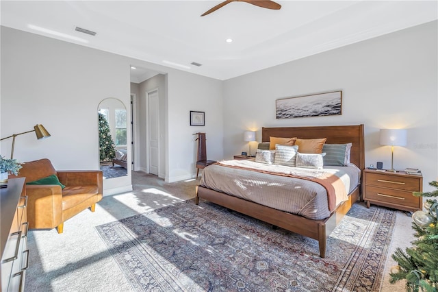 carpeted bedroom with ceiling fan and access to exterior