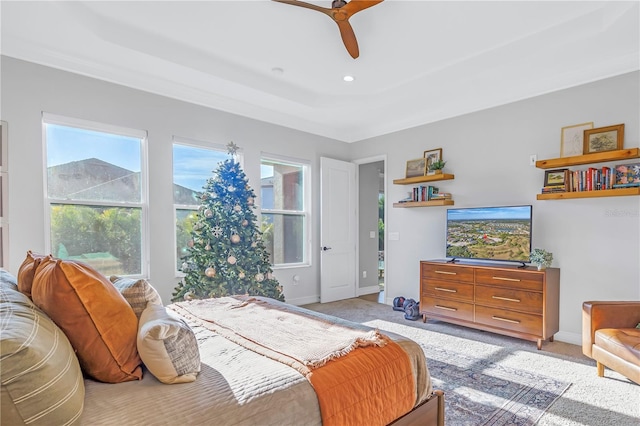 bedroom with ceiling fan and light colored carpet