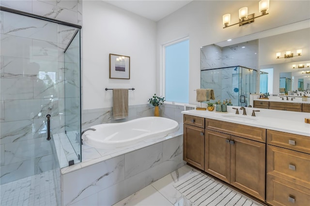 bathroom featuring vanity and independent shower and bath