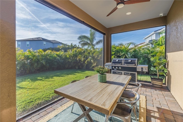 sunroom / solarium with ceiling fan