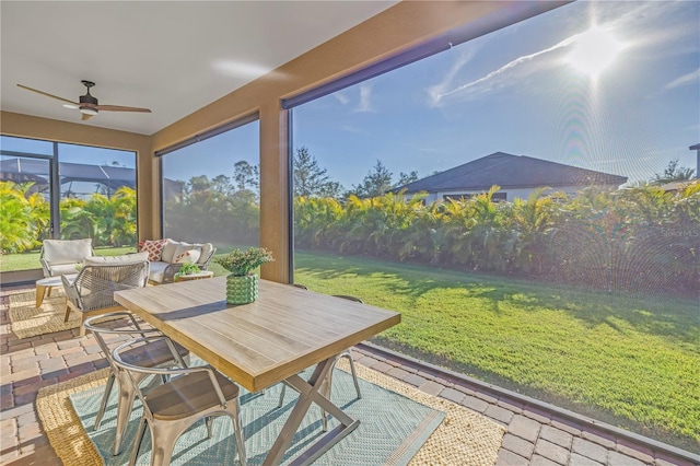 sunroom / solarium with ceiling fan