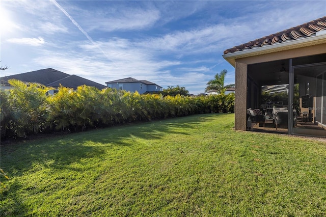 view of yard with a sunroom