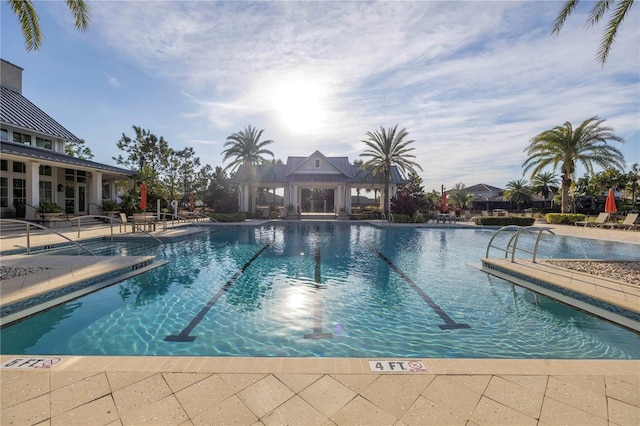 view of swimming pool with a gazebo and a patio area