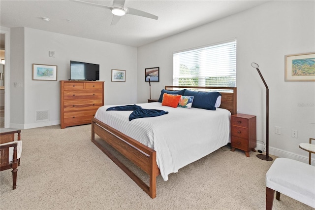 bedroom featuring light carpet and ceiling fan