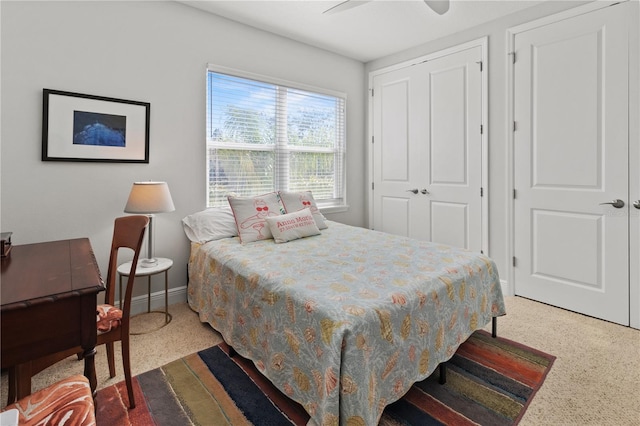 carpeted bedroom featuring ceiling fan