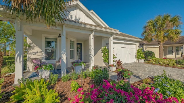 view of front of property featuring a porch and a garage