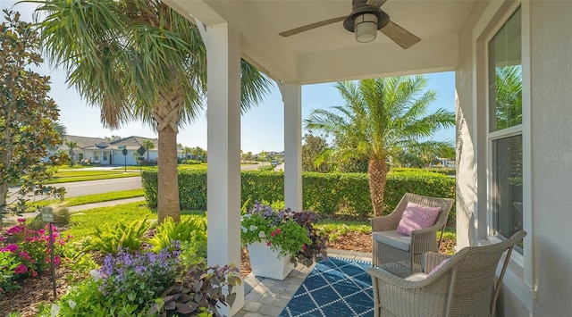 exterior space with ceiling fan