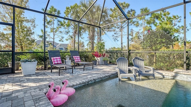 view of patio with glass enclosure