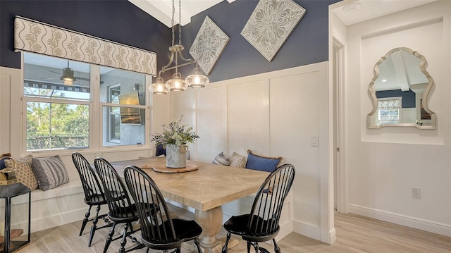 dining area featuring light hardwood / wood-style floors and ceiling fan