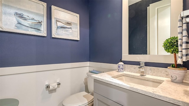 bathroom with vanity and toilet