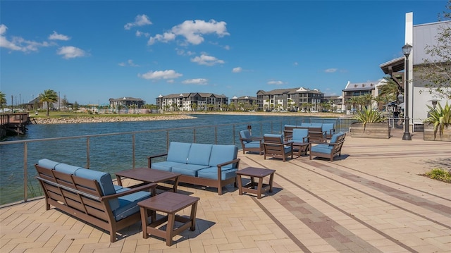 exterior space featuring an outdoor hangout area and a water view