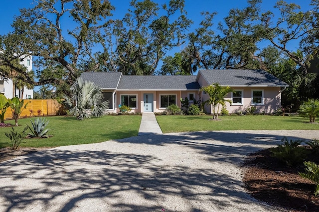 single story home featuring a front yard