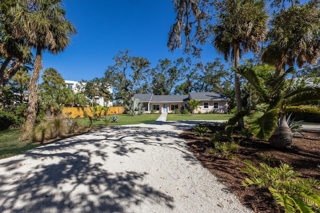 ranch-style house with a front lawn