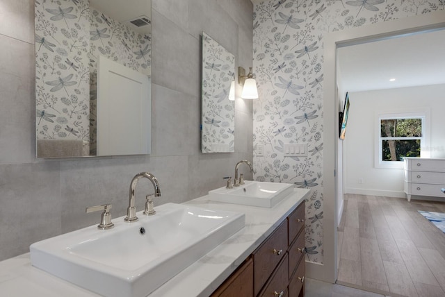 bathroom with vanity and hardwood / wood-style flooring