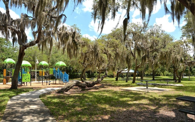 view of community featuring a yard and a playground