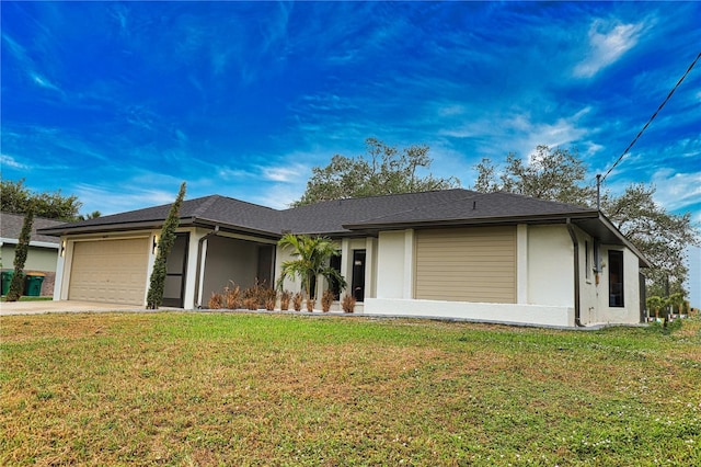 single story home featuring a front yard and a garage