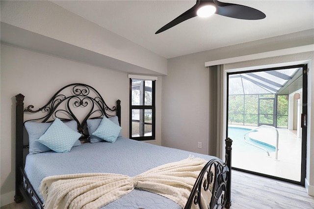 bedroom with access to exterior, light hardwood / wood-style floors, and ceiling fan