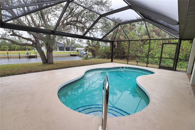 view of swimming pool featuring a patio area and a water view