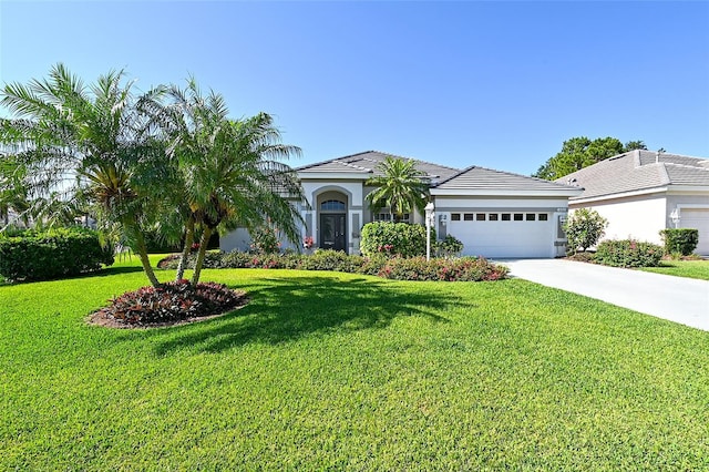 8334 Sailing Loop, Lakewood Ranch, FL 34202 - view of front of house with a garage, a front yard, and concrete driveway