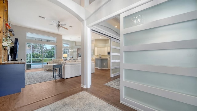 8334 Sailing Loop, Lakewood Ranch, FL 34202 - entryway featuring arched walkways, a ceiling fan, and wood finished floors
