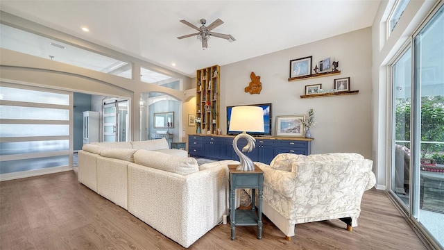 8334 Sailing Loop, Lakewood Ranch, FL 34202 - living room with a ceiling fan, wood finished floors, arched walkways, and recessed lighting