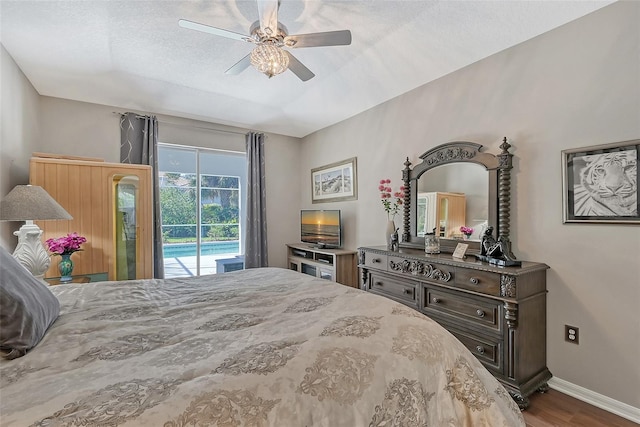 8334 Sailing Loop, Lakewood Ranch, FL 34202 - bedroom with access to exterior, wood finished floors, and a ceiling fan