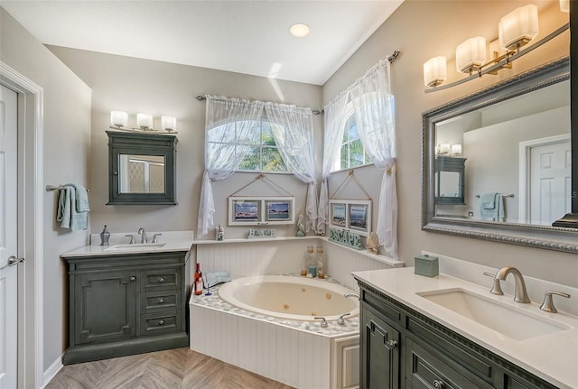 bathroom with a bathing tub, vanity, and parquet floors