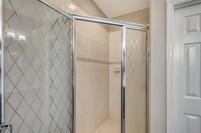 bathroom with a shower with shower door