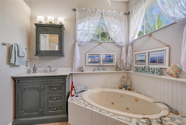 8334 Sailing Loop, Lakewood Ranch, FL 34202 - full bathroom featuring vanity and a tub with jets