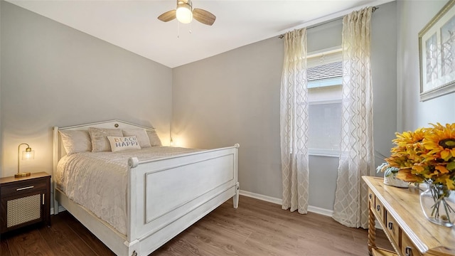 8334 Sailing Loop, Lakewood Ranch, FL 34202 - bedroom with wood finished floors and a ceiling fan