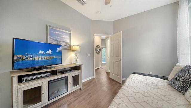 8334 Sailing Loop, Lakewood Ranch, FL 34202 - bedroom with wood finished floors and a ceiling fan