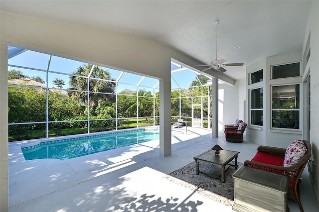 view of pool with a patio area, ceiling fan, and a lanai