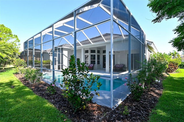 8334 Sailing Loop, Lakewood Ranch, FL 34202 - rear view of house featuring a patio, a yard, an outdoor pool, and glass enclosure