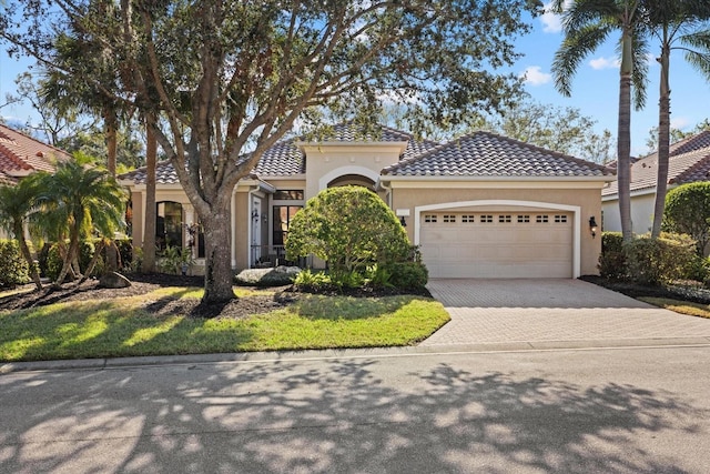 mediterranean / spanish-style house featuring a garage