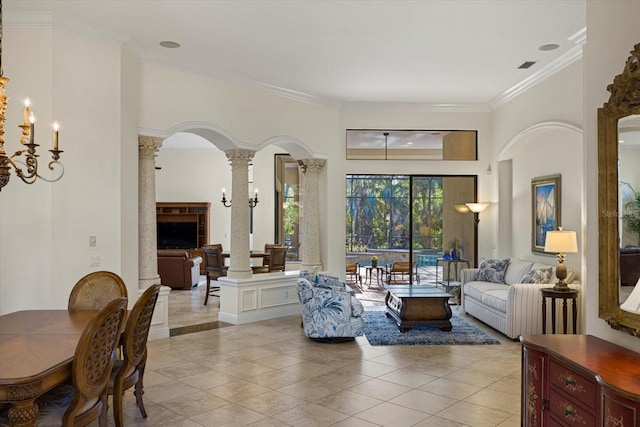 tiled living room with ornate columns and ornamental molding