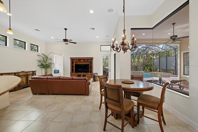 tiled dining area with ceiling fan with notable chandelier