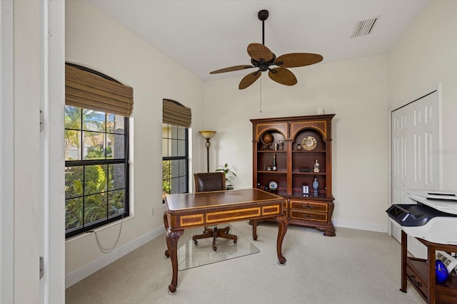 office area featuring light colored carpet and ceiling fan