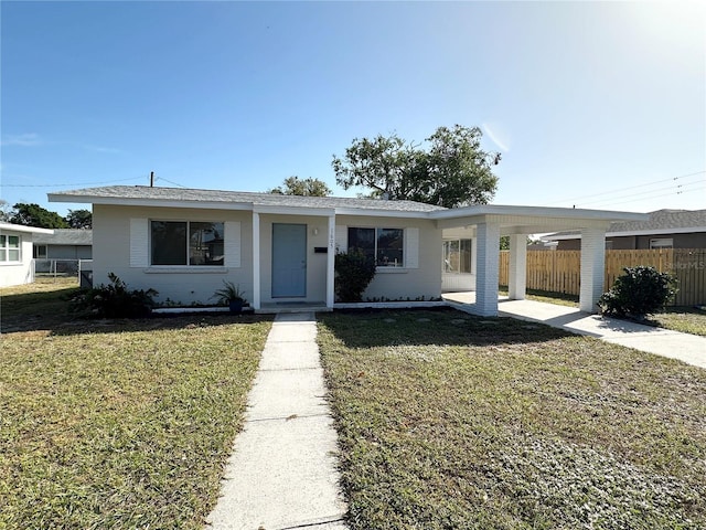 single story home with a carport and a front yard