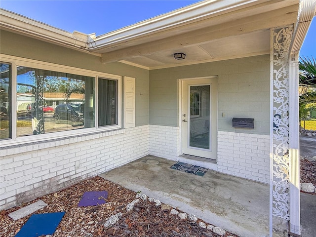 doorway to property with a patio