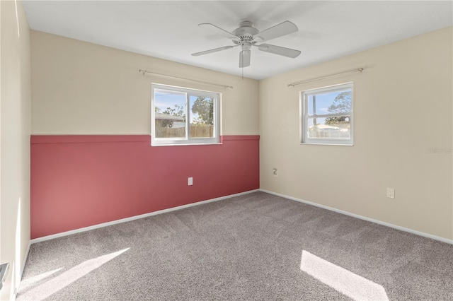 spare room with ceiling fan and carpet floors