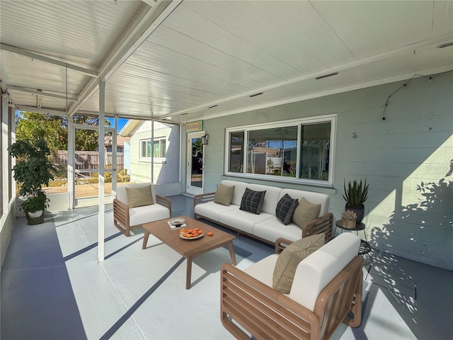 sunroom / solarium featuring an outdoor living space