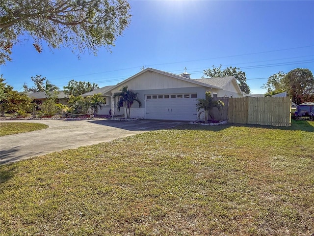 single story home with a garage, driveway, a front lawn, and fence