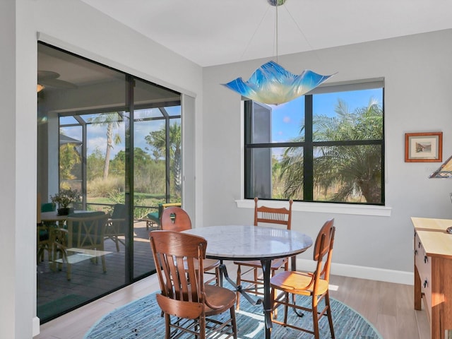 dining area featuring light wood-type flooring