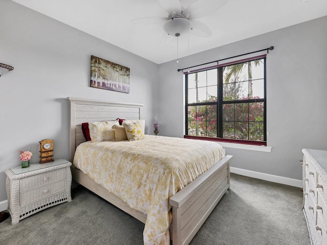 bedroom with ceiling fan and dark colored carpet