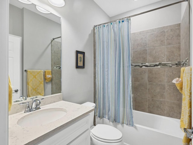 full bathroom featuring shower / bath combination with curtain, toilet, and vanity