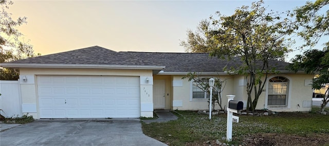 ranch-style home with a garage