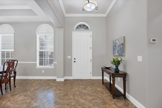 foyer entrance featuring crown molding