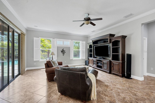 living room with crown molding, ceiling fan, light tile patterned flooring, and a textured ceiling