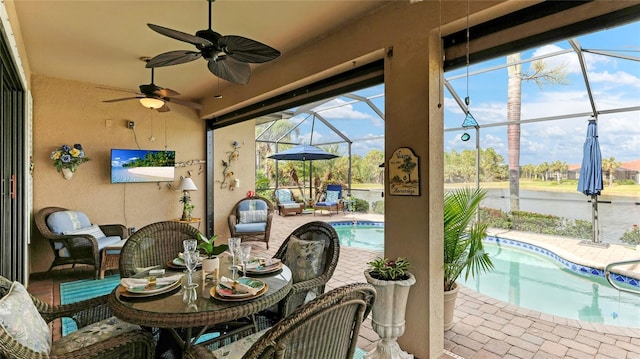 view of patio / terrace with a lanai and ceiling fan